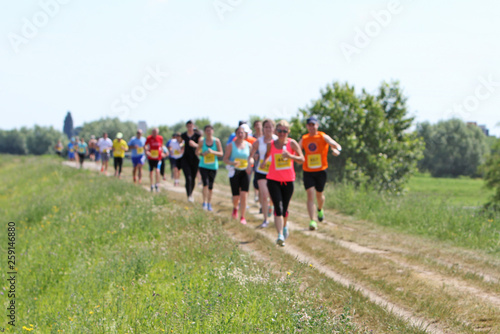 A lot of people on Marathon running in nature