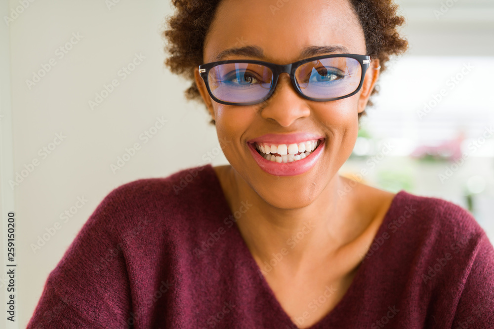 Beautiful young african woman with afro hair wearing glasses Beautiful young african woman with afro hair wearing glasses