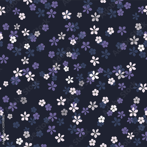 Beautiful floral vector seamless pattern. Small white, blue and purple flowers on navy blue background for textile, wallpaper, print, carton, banner, ceramic tile, glass mosaic.