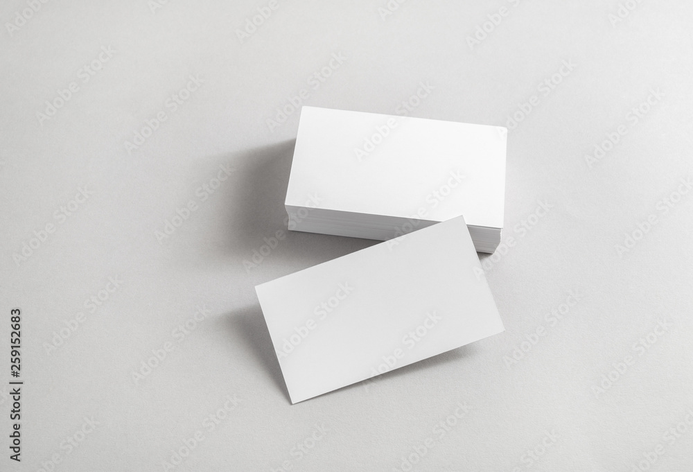 Photo of blank business cards on paper background. Template for ID. Photo of blank business cards on paper background. Template for ID.