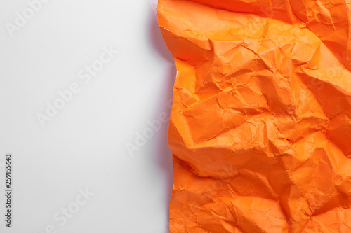 Composition of crumpled sheet of paper placed on a white background