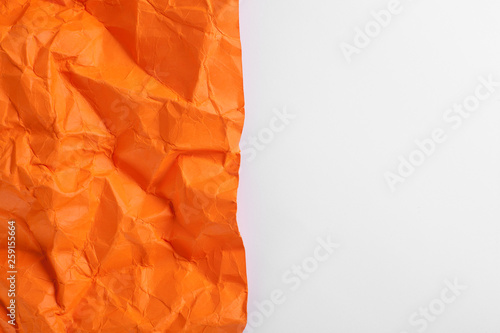 Composition of crumpled sheet of paper placed on a white background