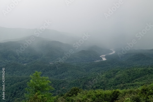 Mountain view evening of heavy rain storm above the hills at Doi Samur Dao, Srinan National Park, Nan, Thailand.