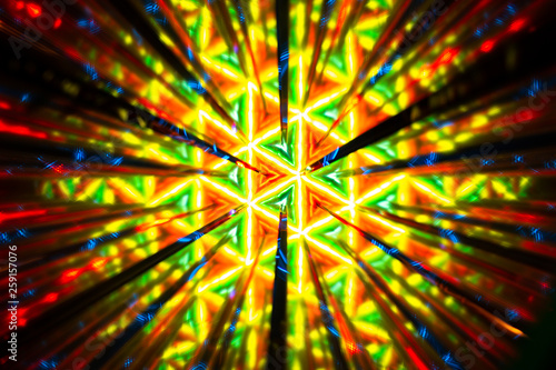 Repetitive pattern by reflections of an image in mirrors. Color kaleidoscopic image.