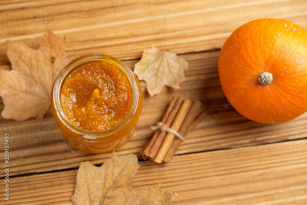 Homemade Pumpkin puree/jam on wooden background Homemade Pumpkin puree/jam on wooden background