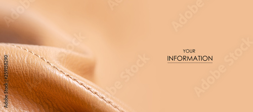 Beige yellow leather material fabric nature pattern on blur background photo