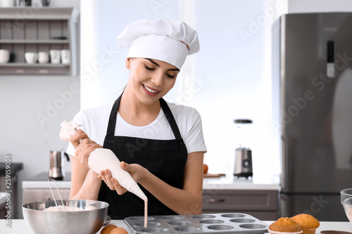 Young female confectioner c...