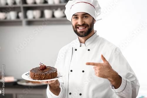 Male confectioner with tast...