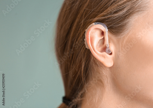 Young woman with hearing on...