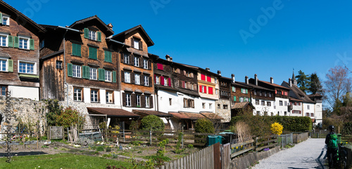 Werdenberg, SG / Switzerland - March 31, 2019: historic Werdenberg village and castle with traditional Burgher homes with wall art and painting