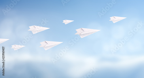 Fototapeta Naklejka Na Ścianę i Meble -  Business competition concept with white paper planes fly on sky background. copy space