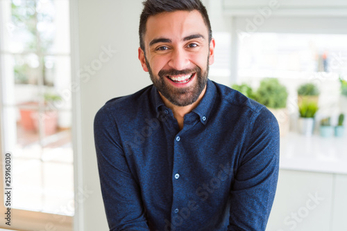 Handsome man smiling cheerful with a big smile on face showing teeth, positive and happy expression © Krakenimages.com