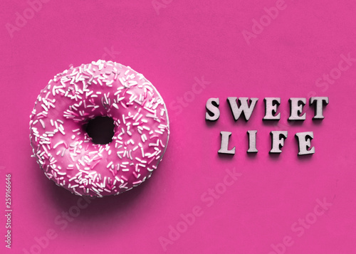 Donut with sprinkles and text "Sweet life"