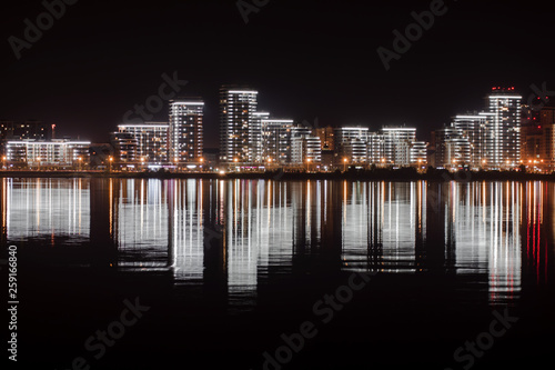 City at night, water reflections  and equalizer