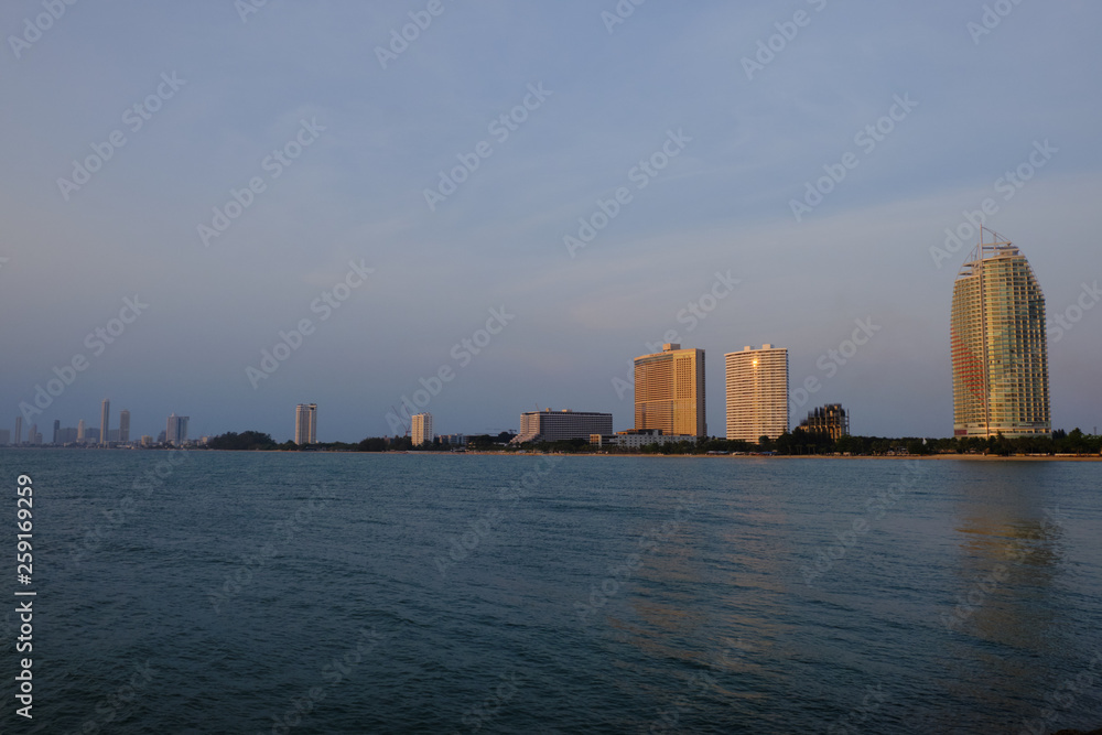 View of the sunset city from the pier in Pattaya