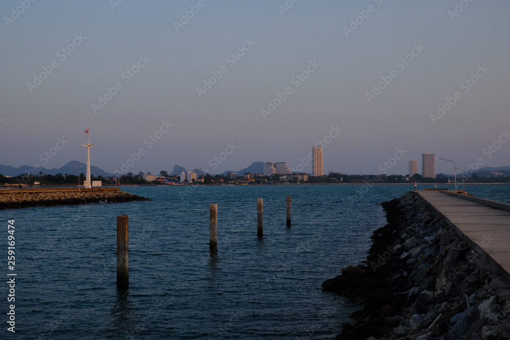 View of the sunset city from the pier in Pattaya