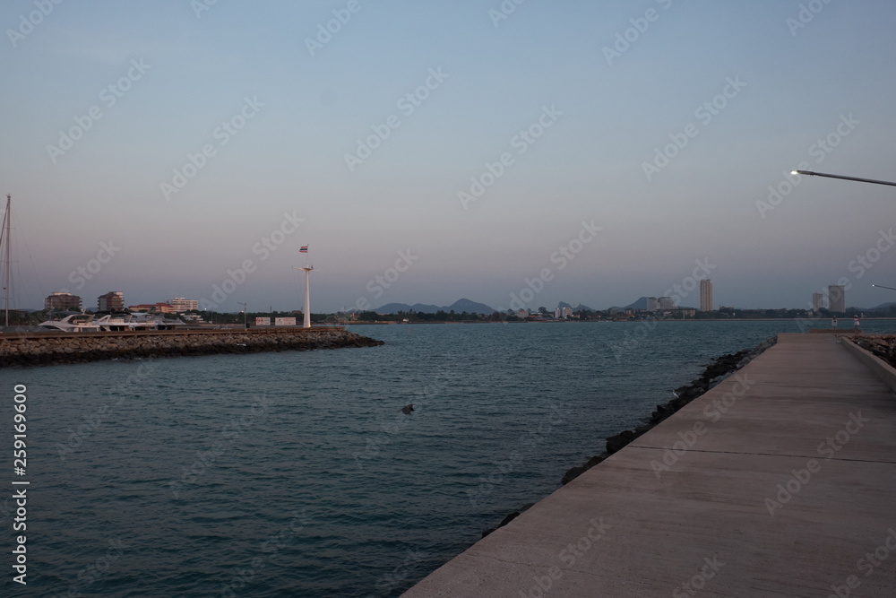 View of the sunset city from the pier in Pattaya