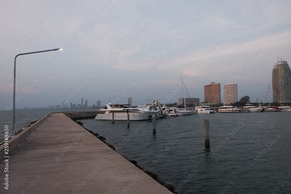 View of the sunset city from the pier in Pattaya View of the sunset city from the pier in Pattaya