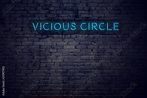 Slika na platnu Brick wall and neon sign with text vicious circle