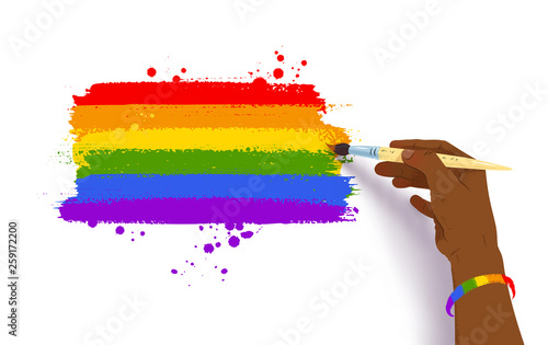 Hand drawing rainbow arc in LGBT flag colors