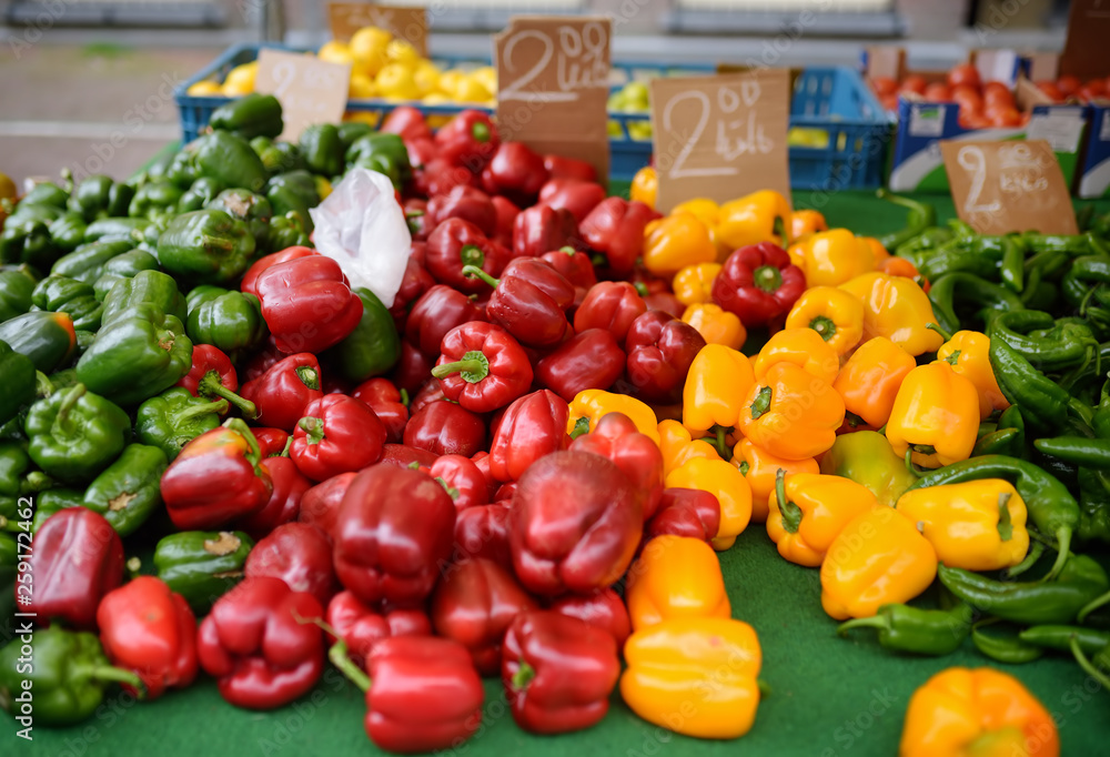Fresh healthy bio red, green and yellow paprika on farmer agricultural market