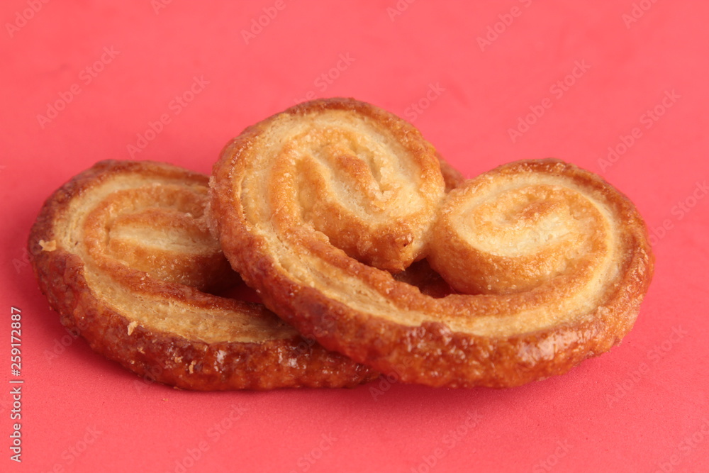 Puff pastry cookies on colorful background Puff pastry cookies on colorful background