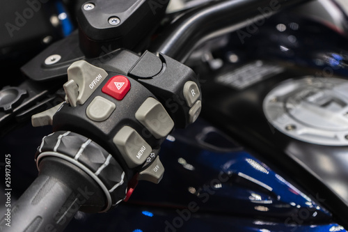 Close up detail of racing motorcycle handlebar. Selective focus for background. Motorsport background concept. © ezstudiophoto