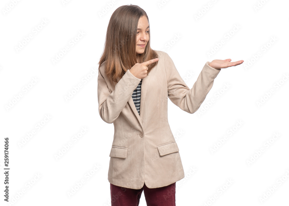 Portrait of teen girl holding something imaginary on palm, isolated on white background. Funny teenager showing copyspace on palm. Child looking away and smiling. Portrait of teen girl holding something imaginary on palm, isolated on white background. Funny teenager showing copyspace on palm. Child looking away and smiling.