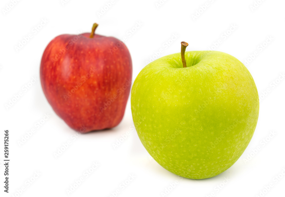 green and red apples on white background.