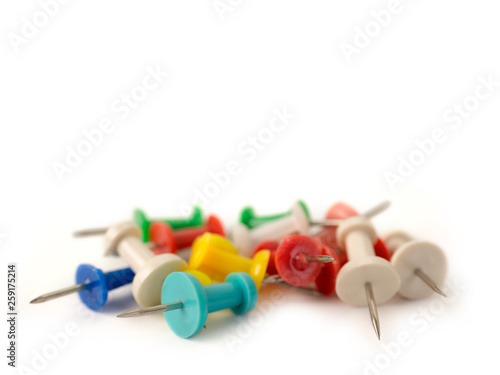 Set of color pins on white background.