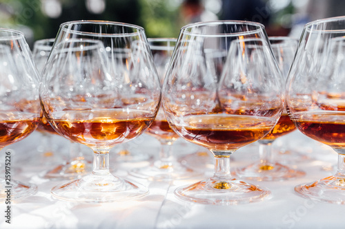 glasses of cognac or brandy on table in restaurant