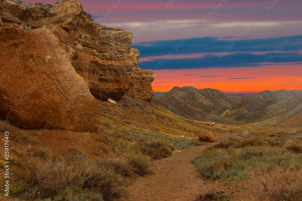 national park, sunset among the stones, colored mountains, travel to the canyon