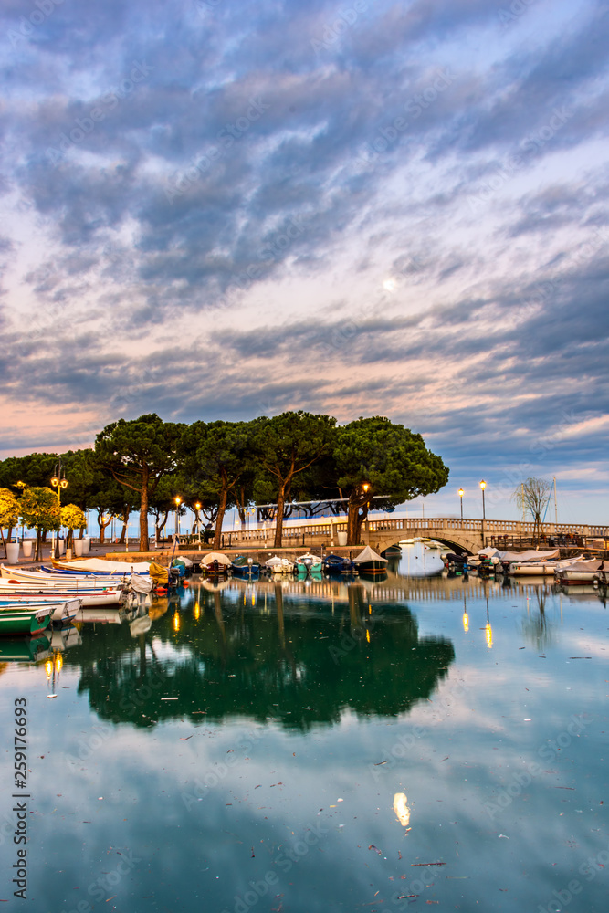 Sunset over marina at Lake Garda in Desenzano, Italy
