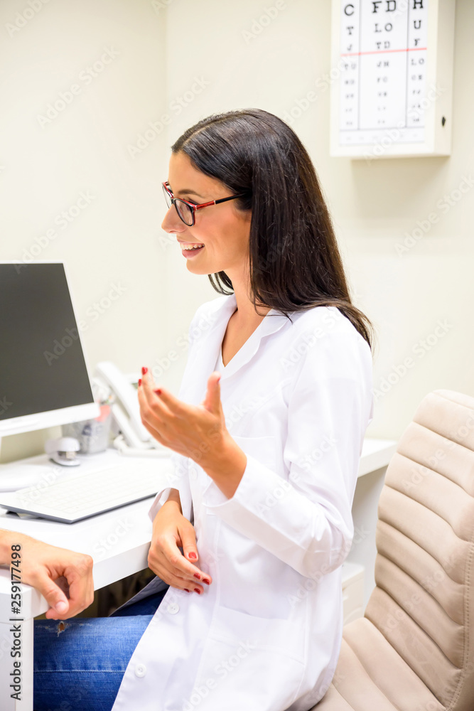 A female Doctor explaining a Diagnosis in the consultation room A female Doctor explaining a Diagnosis in the consultation room