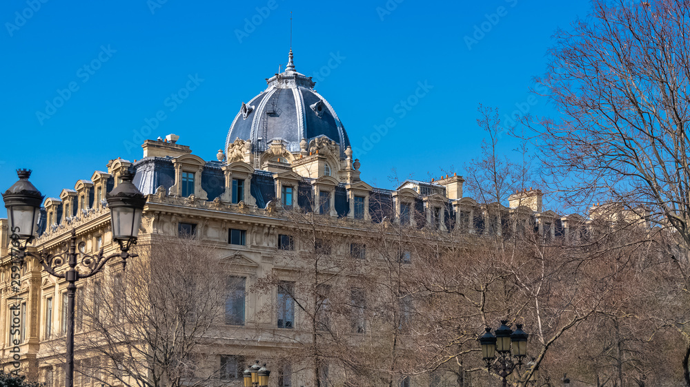 Paris, beautiful building on the ile de la Cite, typical parisian facade and dome of the police headquarters
