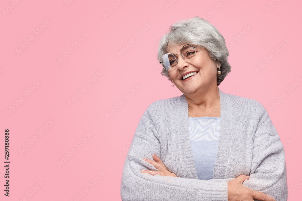 Satisfied elderly female looking away Satisfied elderly female looking away