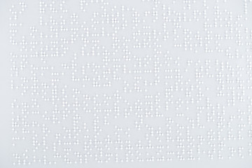 top view of text in international braille code on white paper