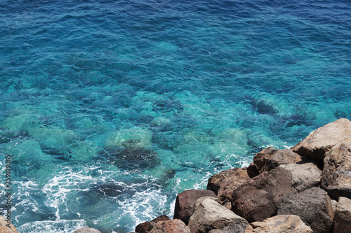 Clean blue turquoise sea and rocks