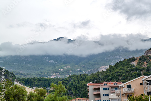 Clouds over mountains and houses. Budva, Montenegro © Dmitrii Brodovoi