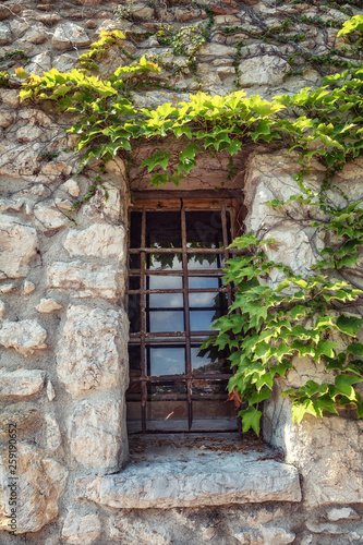 Window in a wall of a medieval house in the French village of Eze