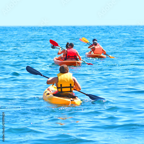 Sea Kayaks. Kayaking and canoeing together background. © Dmytro
