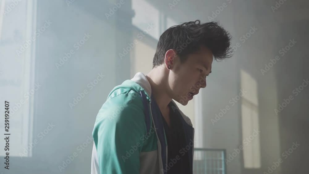 Portrait of a street hip-hop dancer tuning in for dance. Slow motion. Portrait of a street hip-hop dancer tuning in for dance. Slow motion.