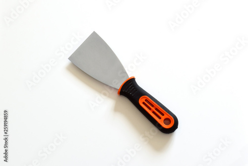 The trowel is designed for laying, spraying and leveling sand-cement mortars. On a white background, close-up