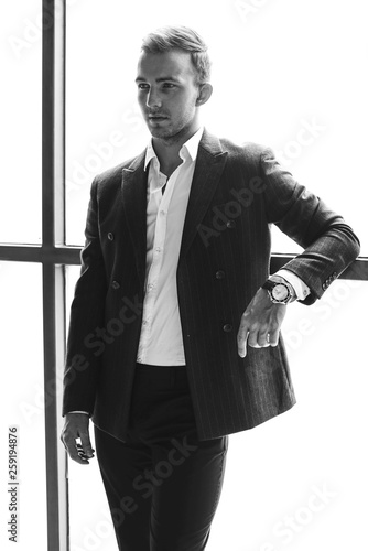 young business man in black suit