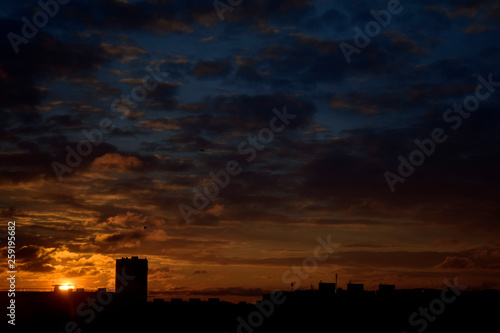 beautiful morning sunrise in the city against the red sky