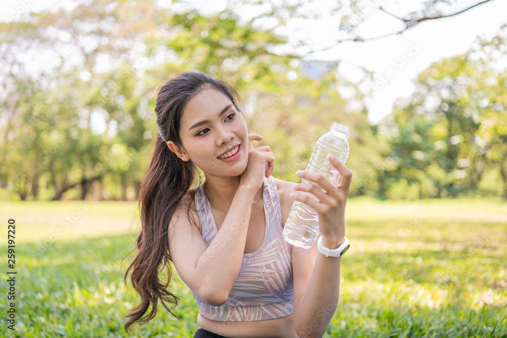 Exercise concept. Beautiful girl tired from exercise. Beautiful girl drinking water with thirst. Exercise concept. Beautiful girl tired from exercise. Beautiful girl drinking water with thirst.