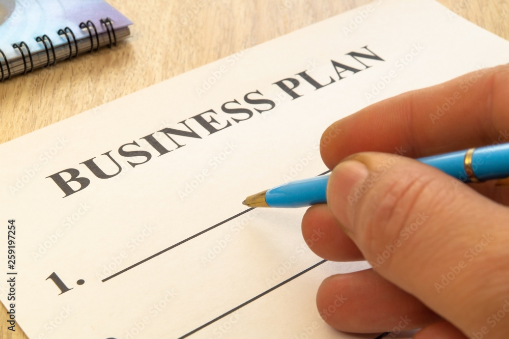 Strategy business plan with pen and notepad on table. Strategy business plan with pen and notepad on table.