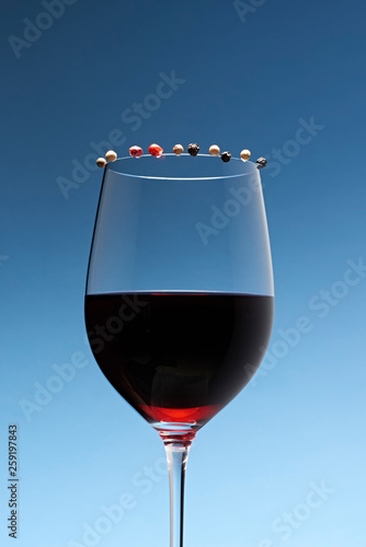 Wine in glass against blue background