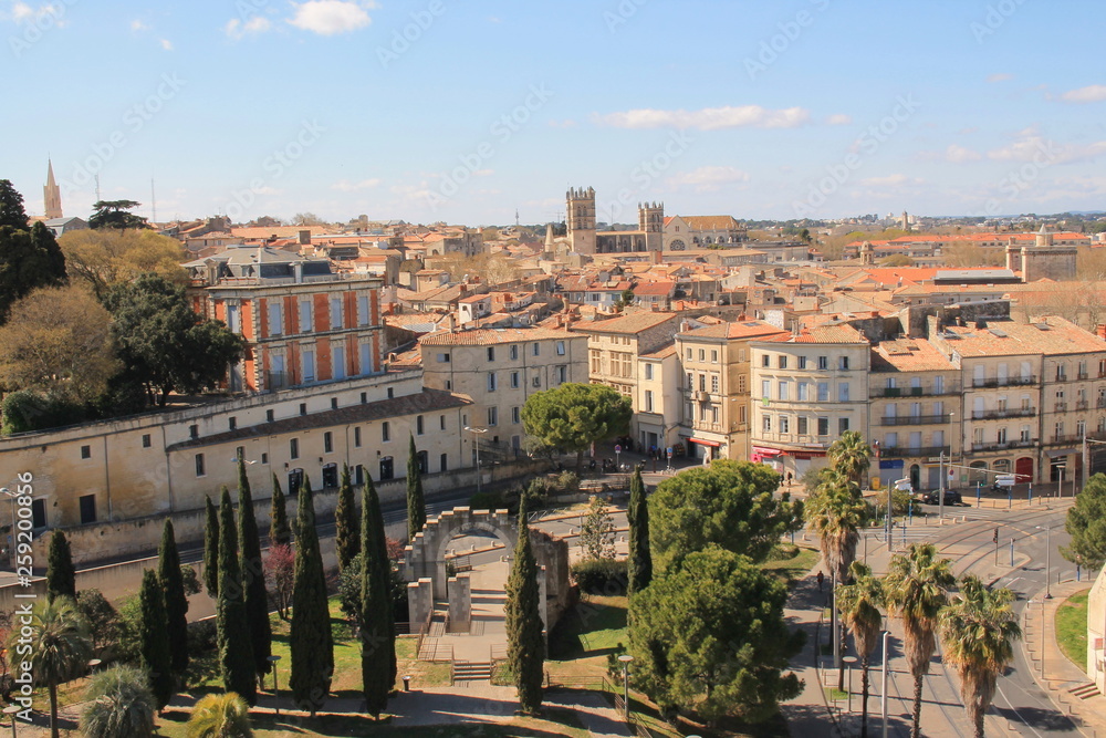 Fototapeta premium Beautiful aerial view over the historic center and St. Peter's Cathedral in Montpellier, city in southern France and capital of the Herault department