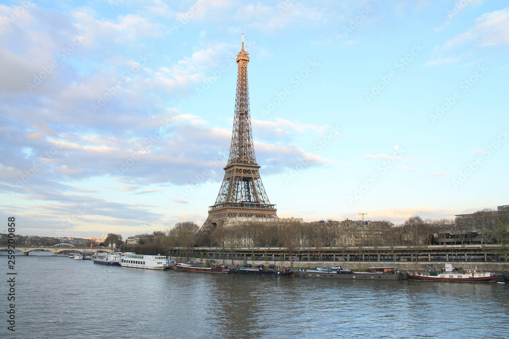 Fototapeta premium Beautiful sky over the Eiffel tower and river seine, Paris capital and the most populous city of France